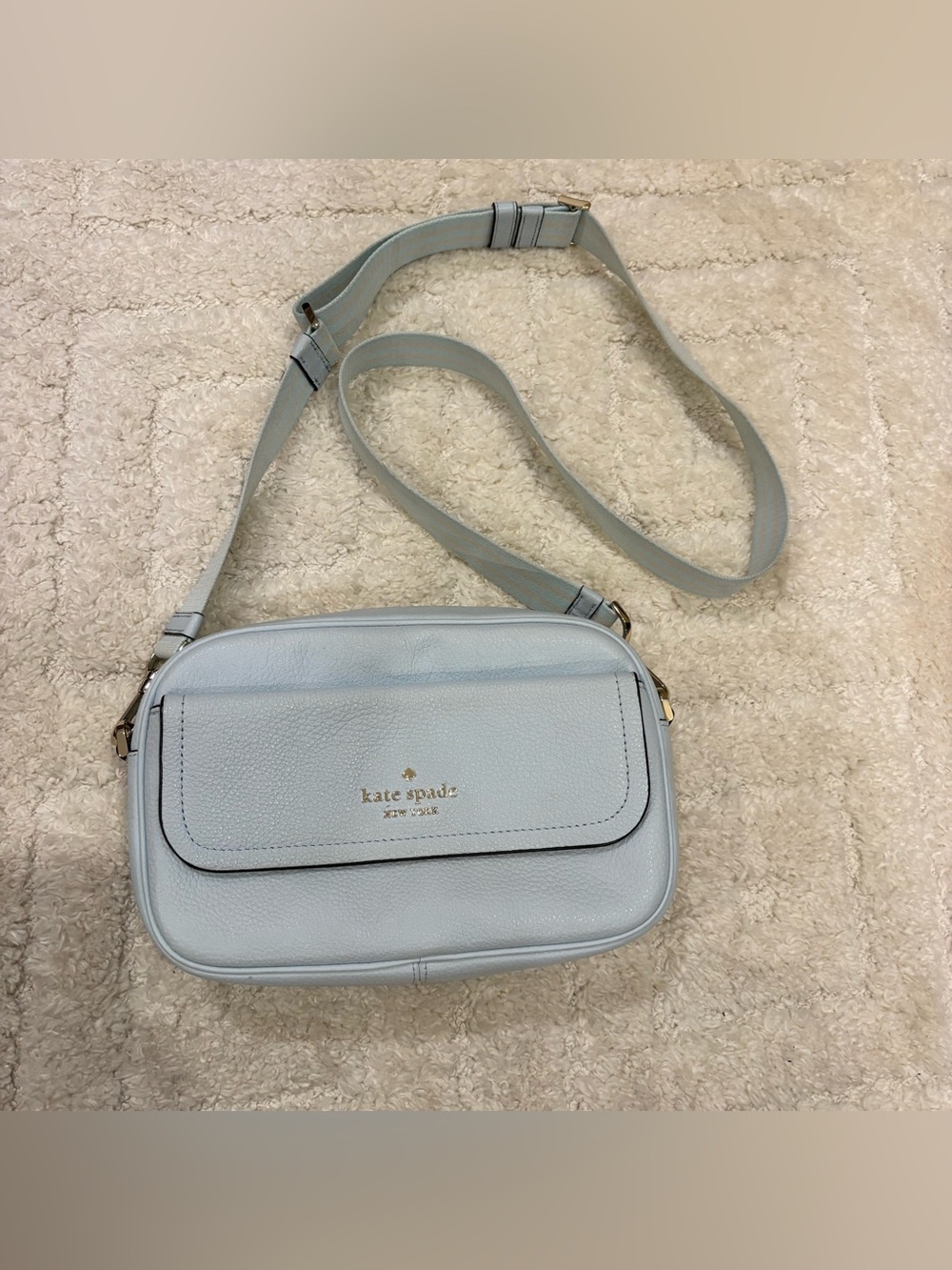 Kate Spade New York Rosie Pebbled Leather flap camera bag in Crisp sky blue.